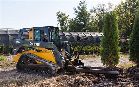 john deere skid steer on a tariler|skid steer attachments for tractors.